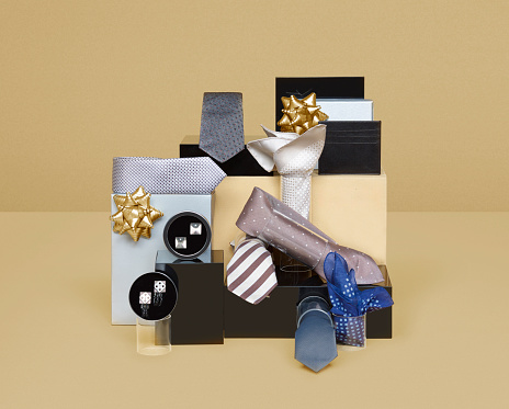 Realistic blak gift box with golden ribbon bow background. Concept of abstract holiday, birthday, black friday sales or wedding present or surprise. 3d high quality isolated render