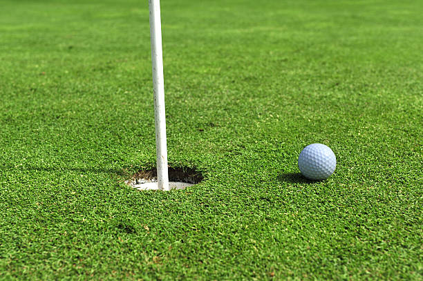 istock Golf ball stops close to hole 183540805