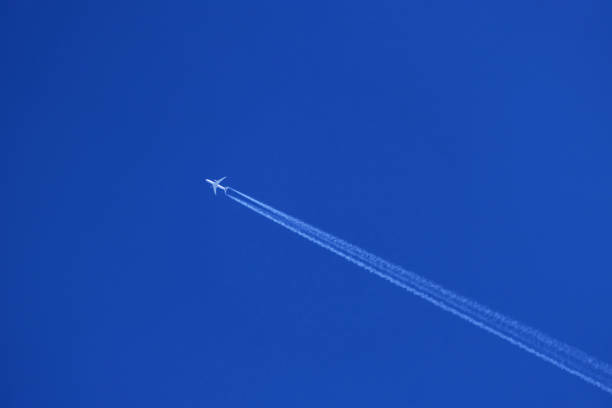 istock Airplane trail in the blue sky, contrail 1835408592