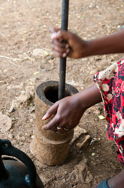 istock Woman grounding coffee beans in Ethiopia 183540892