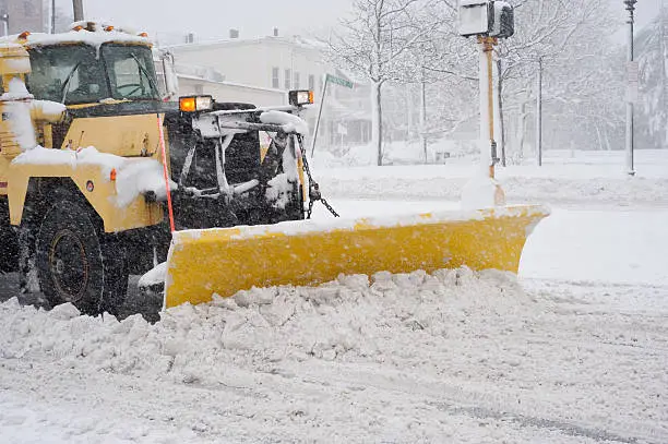 Photo of Big Yellow Snow Plow in a Blizzard