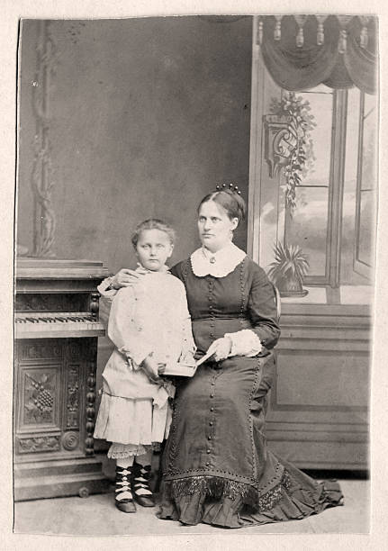 Mother with child Vintage photo of mother with a child. Photo aged 1870s 19th century style photos stock pictures, royalty-free photos & images