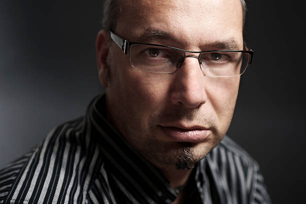 istock Portrait of angry looking man 183541951
