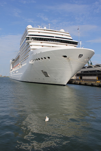 MSC Poesia cruise ship in the port of Gdynia, Poland. Entering the port and mooring at the French Quay.