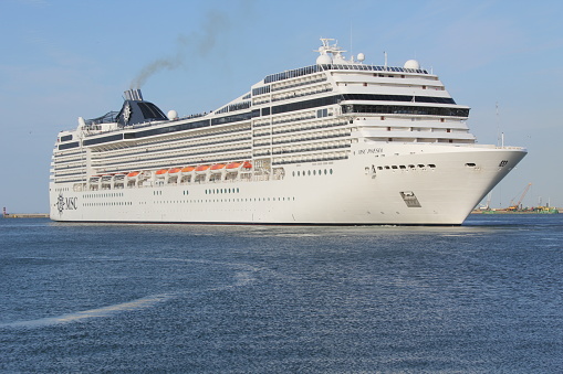 MSC Poesia cruise ship in the port of Gdynia, Poland. Entering the port and mooring at the French Quay.