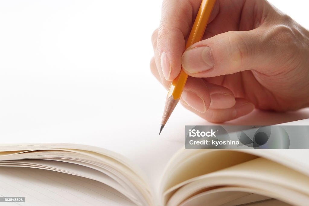 ホールド、イエローペンシルのノートに白背景 - 白背景のロイヤリティフリーストックフォト