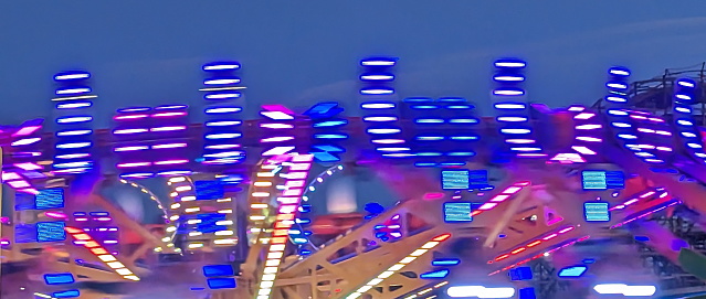 Abstract look of bright lights caught in motion on a summer evening.