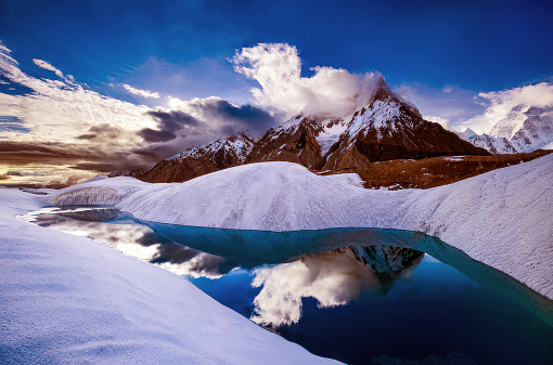 Marble Peak and frozen lake at 6,256 m in the Karakoram mountains range on way to K2 summit
