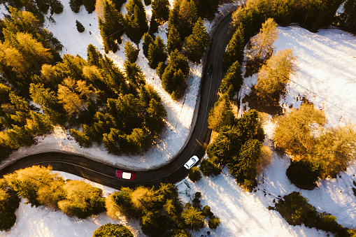 Aerial view of car travelling on a mountain road