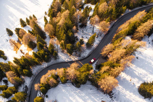 istock Aerial view of car travelling on a mountain road 1835469708