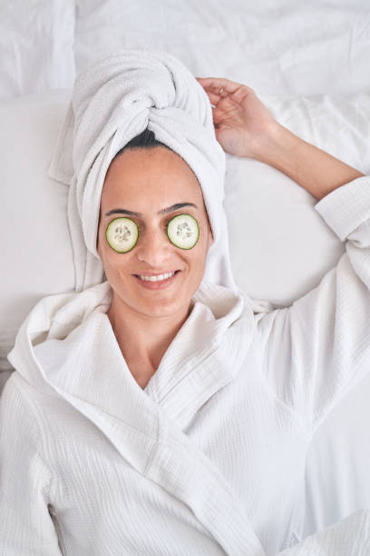 istock Woman with cucumber slices on eyes 1835476811