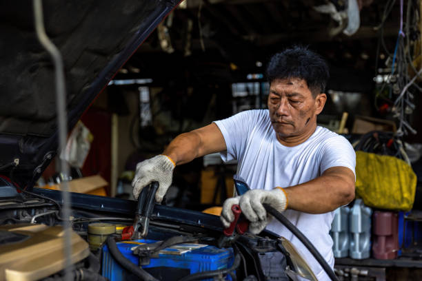 istock Engine engineer is replacing  car battery because car battery is depleted. concept car maintenance 1835477375