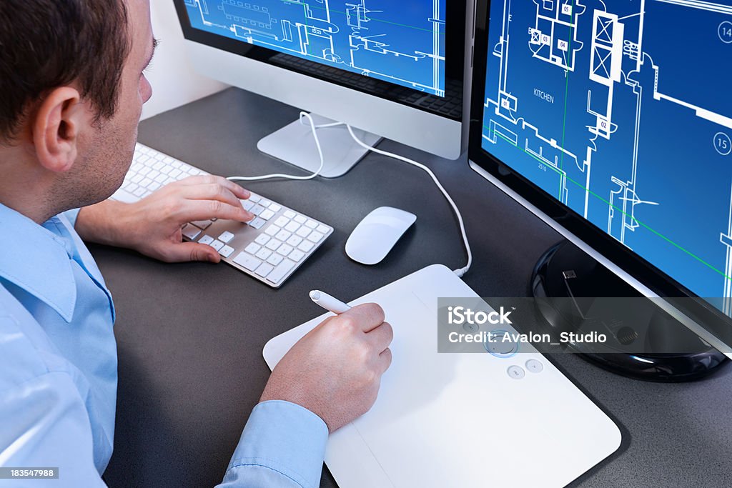 Architect designer. Architect working on a computer project home. Architect designer Blueprint Stock Photo