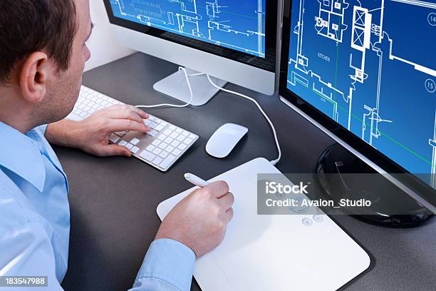 Architect Designer Architect Working On A Computer Project Home Stock Photo - Download Image Now