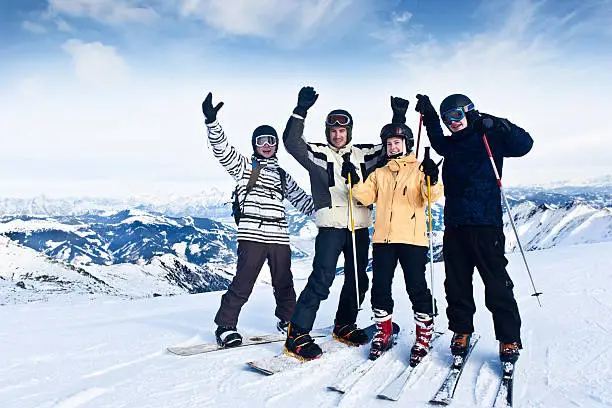 "Four friends (3 boys and 1 girl) having fun in winter vacation. Location: Kitzsteinhorn glacier, Kaprun/Zell am See in Austria. XXL size image.More snowboarder:"