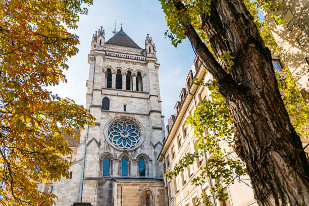 Side view of Saint Pierre Cathedral among autumn trees in Geneva, Switzerland.