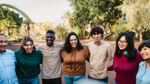 istock Happy multigenerational people with different ethnicities having fun together in a public park - Community concept 1835521470
