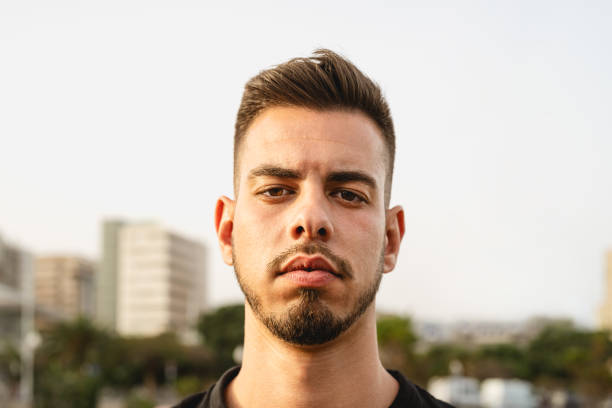 istock Young man looking in front of camera in the city 1835522365