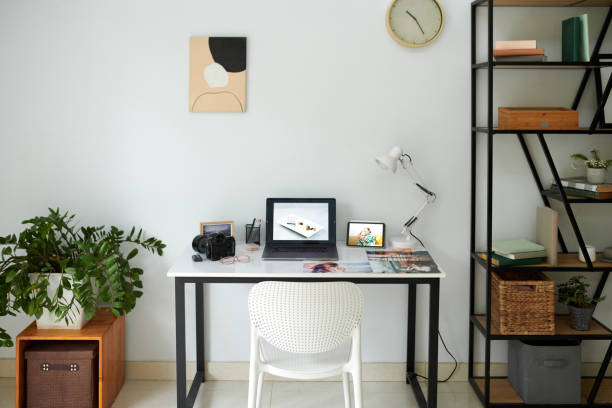 istock Digital camera and laptop on desk of content creator 1835531573