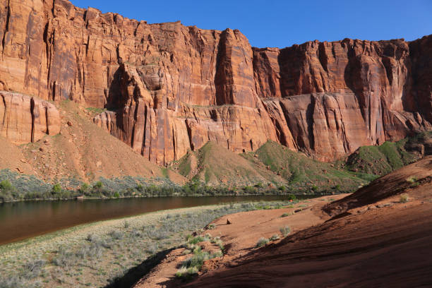 Horseshoe Bend Campsite An orange tent on shore of the Colorado river at Horseshoe Bend, located just outside of Page, Arizona. horseshoe bend river stock pictures, royalty-free photos & images