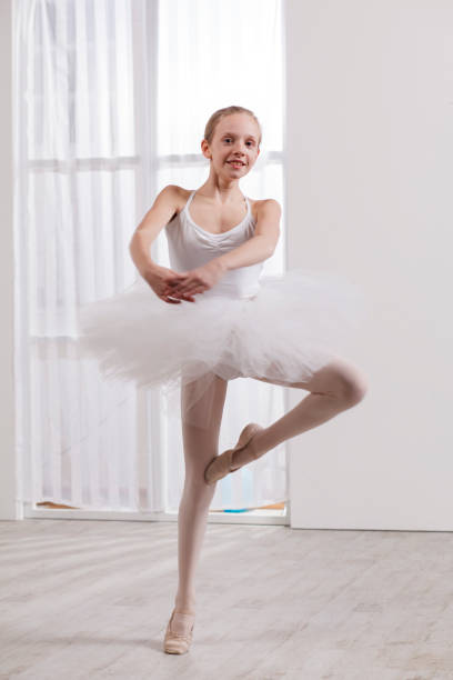 istock Little girl in ballet pose at her home 1835547111
