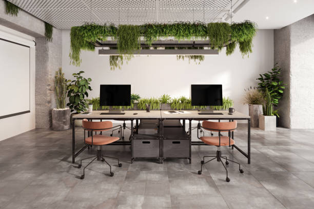 istock Coworking office desk with many computers 1835563296