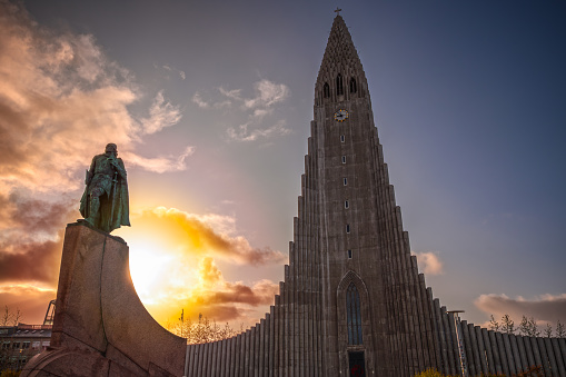 Reykjavík, Iceland - 17 September, 2023 - Hallgrímskirkja (Church of Hallgrímur) and the statue of Leif Erikson at sunrise
