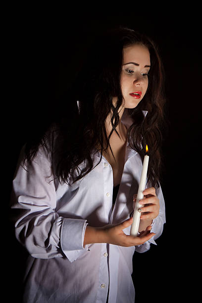 istock Woman with burning candle 183556814