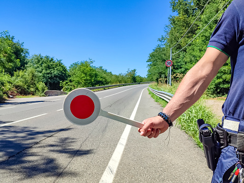 Policeman with a paddle close-up