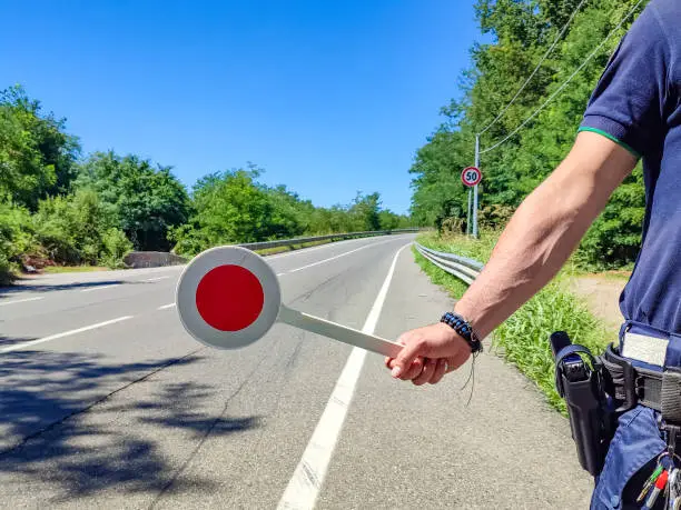 Photo of Policeman with a paddle close-up