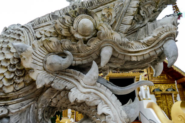 golden dragon statue in thai temple, digital photo picture as a background - luang phabang laos thailand mekong river imagens e fotografias de stock