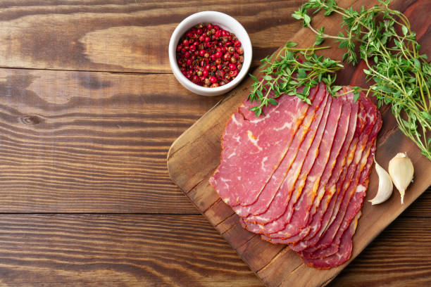 Dried Turkish Pastrami Slices On Wooden  Background