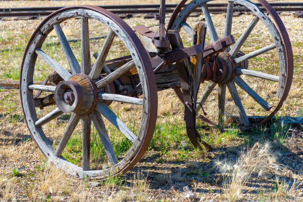istock A wagon wheel positioned in an abandoned field 1835612567