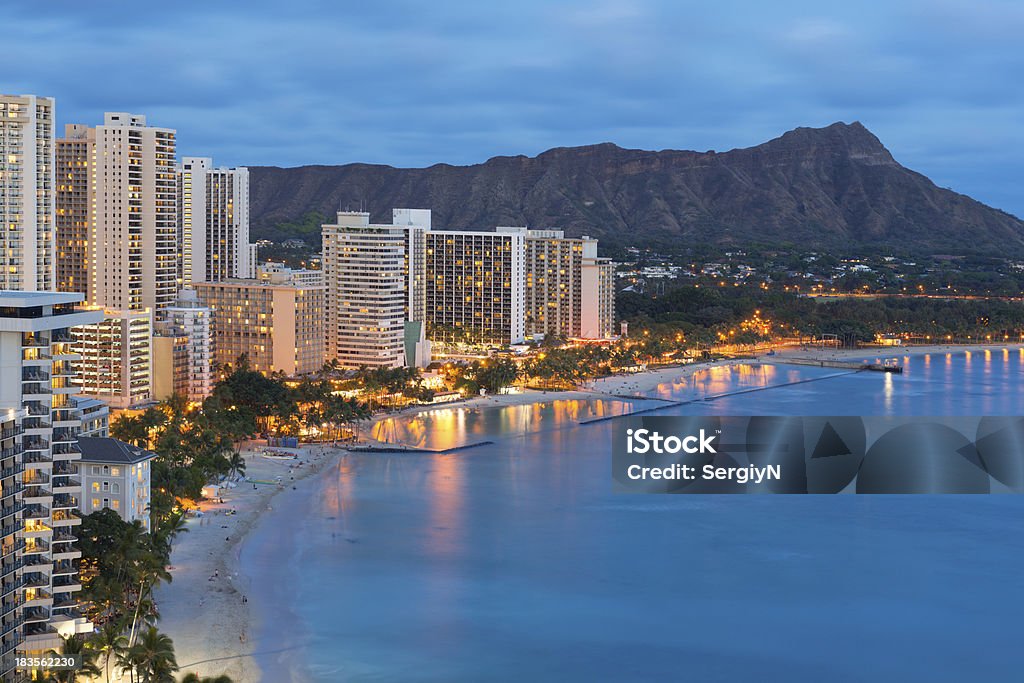 Honolulu city and Waikiki Beach at night Scenic view of Honolulu city, Diamond Head and Waikiki Beach at night; Hawaii, USA Honolulu Stock Photo