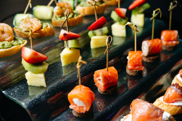 istock Assorted Canapes Selection on Elegant Black Glass Tray 1835636077