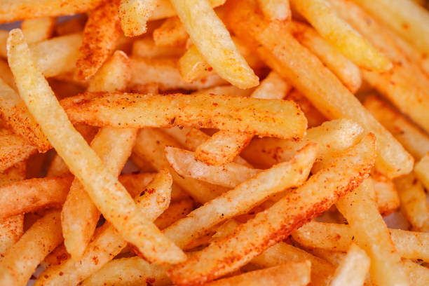 French fries potato sticks, in bulk, close-up, selective focus