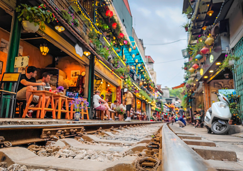 Hanoi train street in Vietnam. A narrow street of the Hanoi Old Quarter where trains passing through the houses. Attraction popular among tourists.