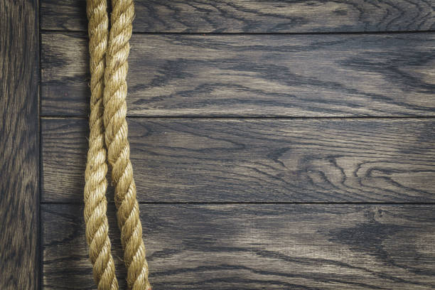 istock Thick rope on wooden background 1835665327
