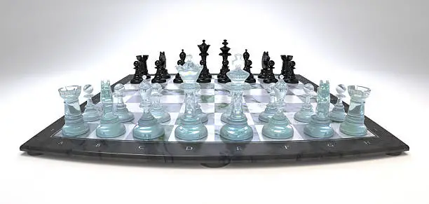 Chess board with chess pieces made of glass and plastic in the opening phase.