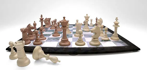 Chess board with played wooden chess pieces.