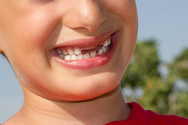 istock baby playing and smiling without teeth 183567051