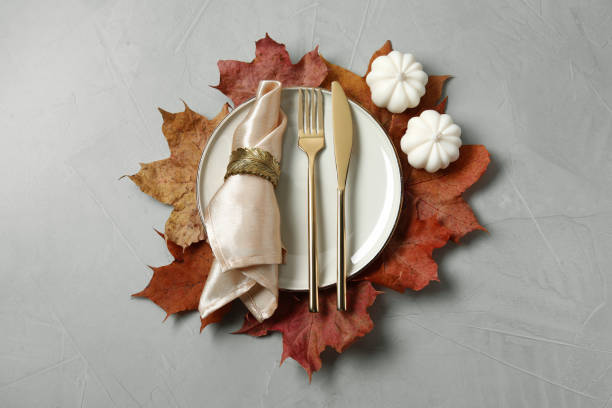 istock Happy Thanksgiving day. Beautiful table setting and autumn decoration on light grey background, flat lay 1835683280