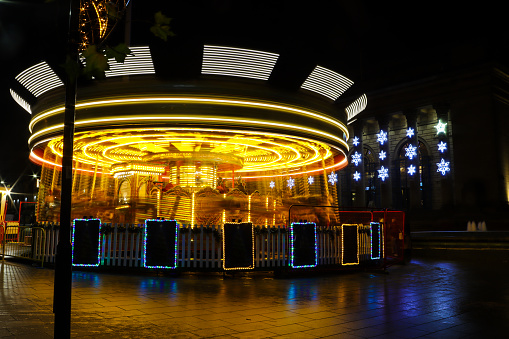 Carousel in the Christmas market at Sheffield with lights and long exposure photo