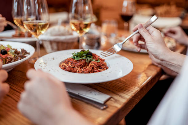 istock Woman Eating Spaghetti in a Restaurant 1835702771