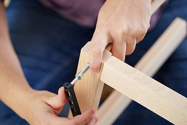 istock Hands assembling piece of furniture 183570569