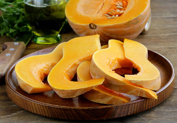 istock fresh raw pumpkin sliced ​​on a wooden table 183571181