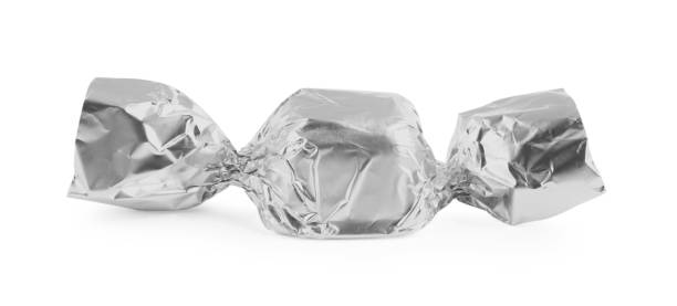 istock Tasty candy in silver wrapper isolated on white 1835714545