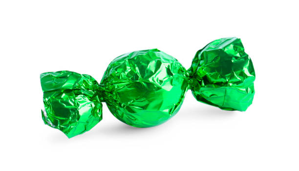istock Tasty candy in green wrapper isolated on white 1835714566