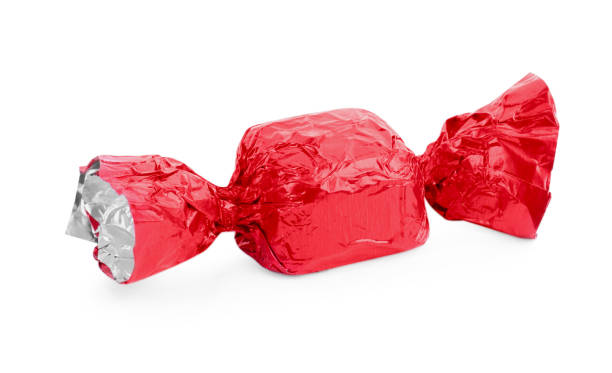 istock Tasty candy in red wrapper isolated on white 1835714870