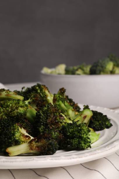 istock Plate with tasty fried broccoli on table, closeup and space for text 1835725465